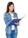 Asian woman take note on clipboard Royalty Free Stock Photo