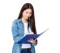 Asian woman take note on clipboard Royalty Free Stock Photo