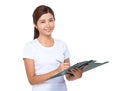 Asian woman take note on clipboard Royalty Free Stock Photo