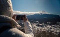 Asian woman take picture with smartphone to beautiful Fuji mountain at Japan
