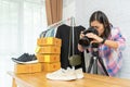 Asian woman taking photo to shoes with digital camera Royalty Free Stock Photo