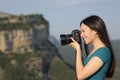 Asian woman taking photos with a dslr camera outdoors Royalty Free Stock Photo