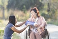 Asian woman taking their mother