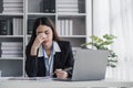 asian woman thinking hard concerned about online problem solution looking at laptop screen, worried serious asian Royalty Free Stock Photo