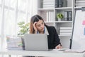 asian woman thinking hard concerned about online problem solution looking at laptop screen, worried serious asian Royalty Free Stock Photo