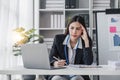 asian woman thinking hard concerned about online problem solution looking at laptop screen, worried serious asian Royalty Free Stock Photo