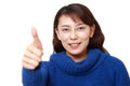 asian woman with thumbs up gesture