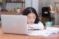 Asian woman with tired overworked and sleep, girl have resting while work writing note, Royalty Free Stock Photo