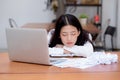 Asian woman with tired overworked and sleep, girl have resting while work writing note, Royalty Free Stock Photo