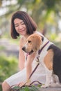 Asian woman together with dog as best friend. Solo outdoor lifestyle