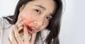 Asian woman with toothache. Seeking toothache relief and oral health care Royalty Free Stock Photo