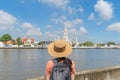 Asian woman, a tourist people, travelling in Temple of Dawn or Wat Arun and Chao Phraya River, Bangkok, Thailand. Urban old town