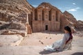 Asian woman tourist sitting in Petra, Jordan Royalty Free Stock Photo