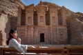 Asian woman tourist sitting in Petra, Jordan Royalty Free Stock Photo