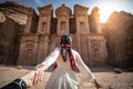 Asian woman tourist holding hand in Petra, Jordan