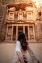 Asian woman tourist holding hand in Petra, Jordan Royalty Free Stock Photo