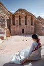 Asian woman tourist sitting in Petra, Jordan Royalty Free Stock Photo