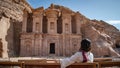 Asian woman tourist sitting in Petra, Jordan Royalty Free Stock Photo