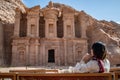 Asian woman tourist sitting in Petra, Jordan Royalty Free Stock Photo