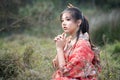 Asian woman tourists. Japanese girl wearing a kimono. Beautiful Female wearing traditional japanese kimono, Japan