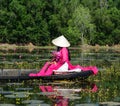 People rowing boat on the lotus lake