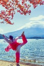 Asian Woman In traditional Japanese Kimono Stretching at Fuji Mountain at Kawaguchiko Lake in Japan. Retro Toned Image Royalty Free Stock Photo