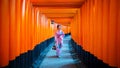 Asian women in traditional japanese kimonos at Fushimi Inari Shrine in Kyoto, Japan