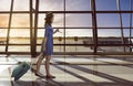 Asian woman travel alone carry suitcase in the airport Royalty Free Stock Photo
