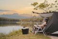 Asian woman travel and camping alone. Businesswoman online working and relaxing during journey outdoor