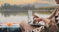 Asian woman travel and camping alone. Businesswoman online working and relaxing during journey Royalty Free Stock Photo