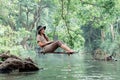 Asian woman travel and camping alone. Businesswoman online working and relaxing during journey outdoor