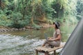 Asian woman travel and camping alone. Businesswoman online working and relaxing during journey outdoor Royalty Free Stock Photo