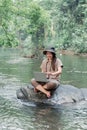 Asian woman travel and camping alone. Businesswoman online working and relaxing during journey outdoor