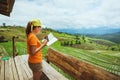 Asian woman travel nature. Travel relax. Standing reading book the balcony of the house. in summer