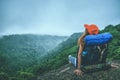 Asian women travel relax in the holiday. Sit on a rocky cliff. Mountain View Thailand Royalty Free Stock Photo