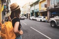 Asian woman traveler backpack city concept, Tourist is walking on the street, Young asian traveling backpacker in phuket old town Royalty Free Stock Photo