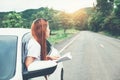 Asian woman traveler with car on Beautiful road