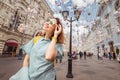 asian woman traveler posing at the Arbat street in Moscow