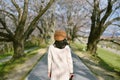 Asian woman traveler sightseeing sakura cherry blossoms in spring season.