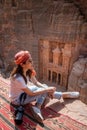 Asian woman traveler sitting in Petra, Jordan Royalty Free Stock Photo