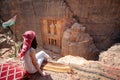 Asian woman traveler sitting in Petra, Jordan Royalty Free Stock Photo