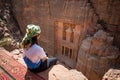 Asian woman traveler sitting in Petra, Jordan Royalty Free Stock Photo