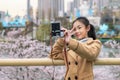 Asian woman traveler take selfie at view point in Seoul city, South Korea in winter season