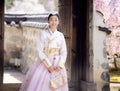 Asian woman traveler in traditional korean dress or hanbok dress Royalty Free Stock Photo