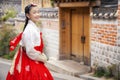 Asian woman traveler in traditional korean dress or hanbok dress Royalty Free Stock Photo