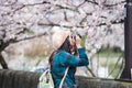 An asian woman traveler was sightseeing Cherry BlossomSakura