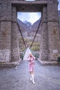 Asian woman traveller at the old architecture of a bridge Royalty Free Stock Photo