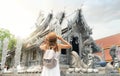 Asian woman traveller in white dress travel in Silver church Royalty Free Stock Photo