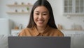 Asian woman typing laptop in kitchen korean vietnamese businesswoman working from home smiling millennial ethnic chinese