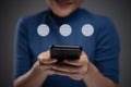 Asian woman using smart phone for voting with emoticon hologram effect Royalty Free Stock Photo